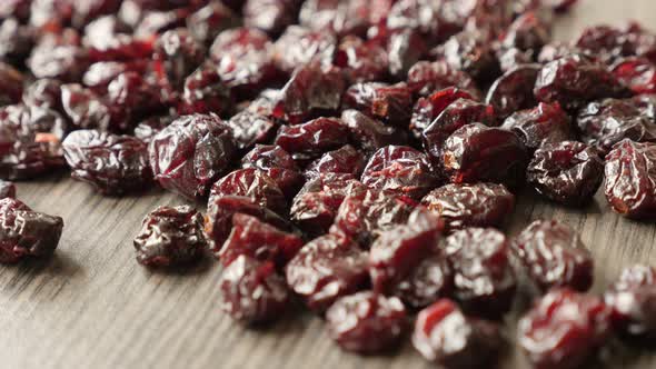 Dried red cranberries on table shallow DOF 4K 2160p 30fps UltraHD tilting footage - Close-up of heal