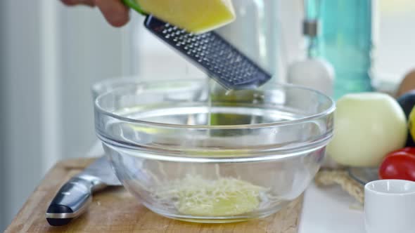 Cook Grating Cheese