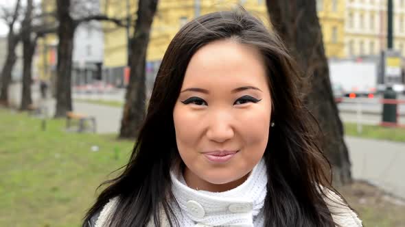 Young Attractive Asian Woman Smiles - Urban Street with Cars - City - Closeup