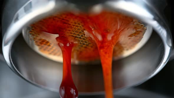 Super Slow Motion Macro Shot of Dripping Fresh Espresso Coffee From Lever Machine at 1000 Fps