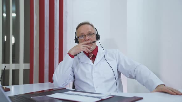 Doctor listening to patient during telemedicine session