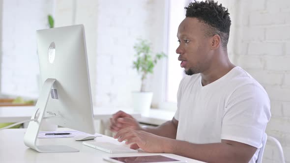 Casual Young African Man Standing Up and Going Away in Office 