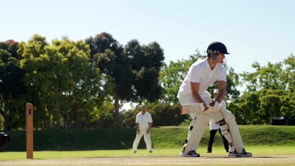 Wicket keeper taking a catch during cricket match