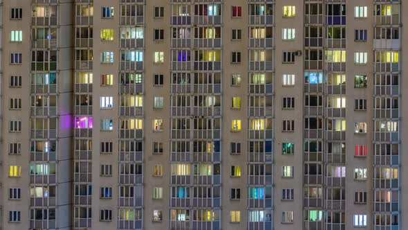 windows of residential buildings timelapse. light in the windows of apartments and apartments.