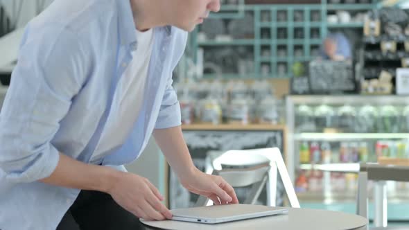 Creative Man Coming Back and Opening Laptop