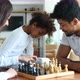 Happy Family Playing Chess Together at Home - VideoHive Item for Sale