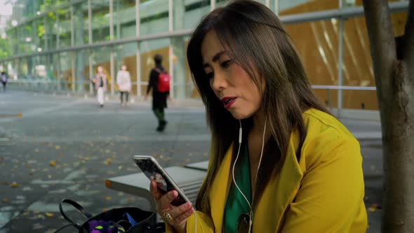 Japanese woman using her smartphone in Tokyo Japan