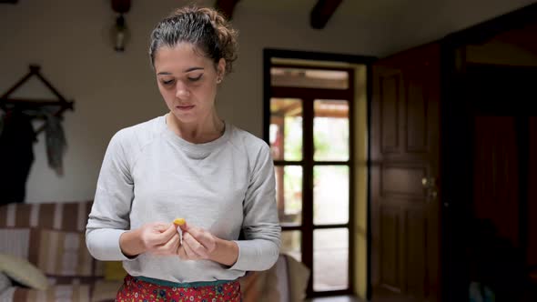 Woman with tasty tortellini at home