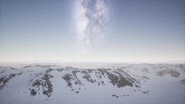 Milky Way Above Snow Covered Terrain alt