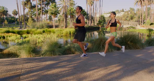 Athlete Couple Jogging In The Park