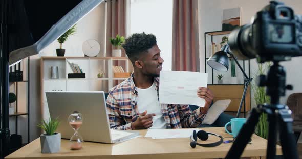 Black-Skinned Male Blogger Recording Videoblog for His Internet Followers