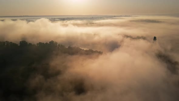 Aerial drone view of nature of Moldova at sunset. River and lush fog above it, greenery
