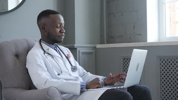 Portrait of Afro American Doctor Using Laptop Computer