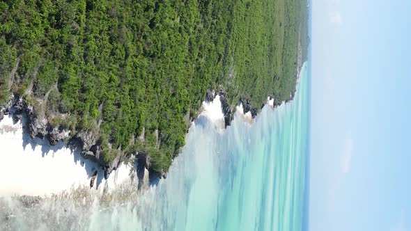 Vertical Video of the Ocean Near the Coast of Zanzibar Tanzania Aerial View