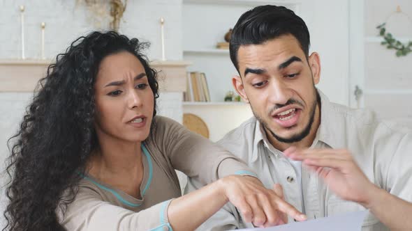 Hispanic Couple Sits at Home on Couch Hold Papers Receive Divorce Documents Letter with Bad News