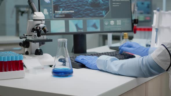 Laboratory Scientist Analyzing Chemical Glass Beaker