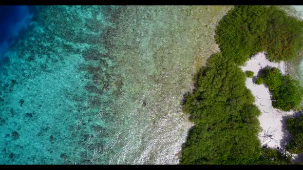 Aerial top down panorama of tranquil island beach adventure by blue ocean with white sand background