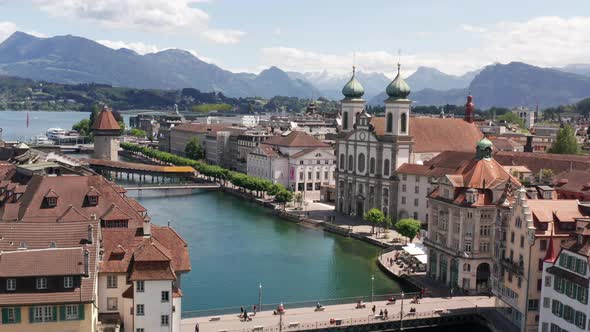 Aerial of historic church and buildings near canal in Luzern, Switzerland