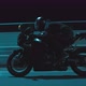 A Man Rides a Sports Motorcycle on a Night Track - VideoHive Item for Sale
