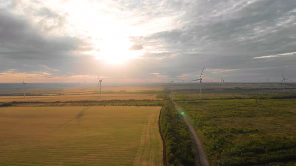 Aerial View of Wind Turbine on a Field in a Summer Day. Environment Friendly and Renewable Energy