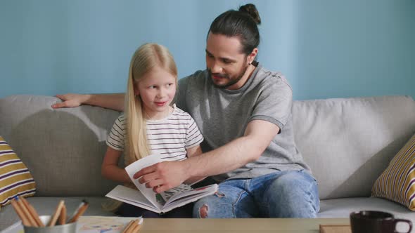 Small Girl Is Studding with His Dad