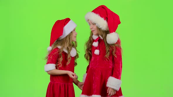 Two Children Are Talking About the Celebration of the New Year. Green Screen. Slow Motion