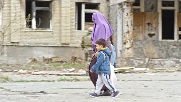 Muslim Woman with Kids in Refugee Camp