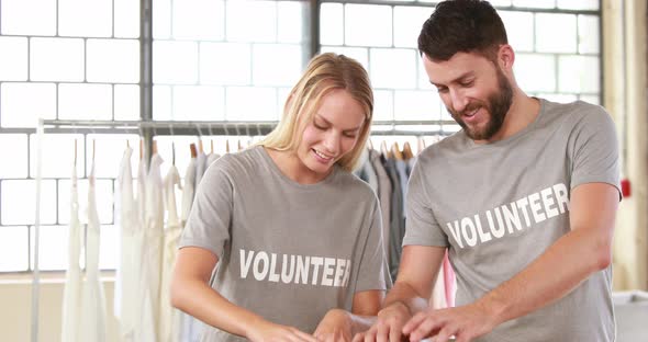 Volunteer Team Looking at Food Donations