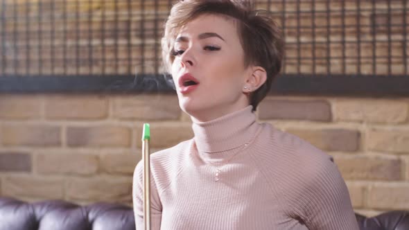 Fair Haired Girl Smoking Flavored Tobacco
