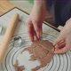 Young Caucasian Woman Cuts Out Cookies From a Dough at Home Kitchen - VideoHive Item for Sale