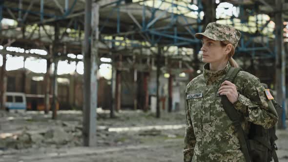 American Officer Examining Ruined Manufacture