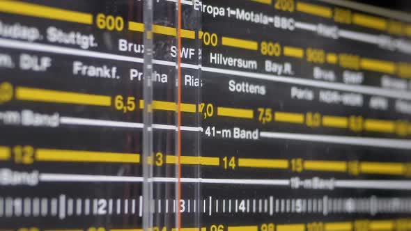 Tuning Analog Radio Dial Frequency on Scale of the Vintage Receiver