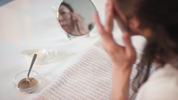 Applying Facial Coffee Scrub