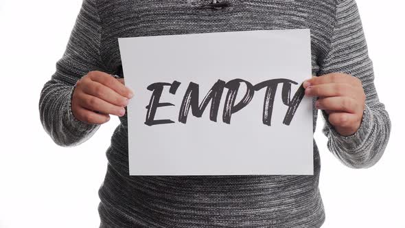 A person holding a sign with the message and the word "empty"