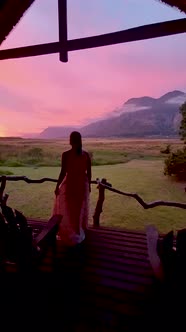 Woman Mid Age in Front of Their Lodge During Vacation in South Africa Mountains and Grassland Near