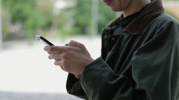 Cropped Shot of Woman Using Mobile Phone Outdoor