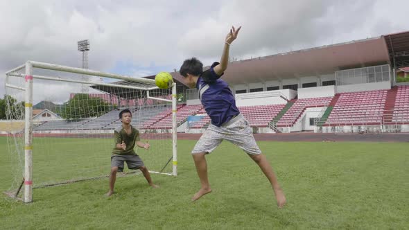 Boy Making A Goal By Heading A Soccer Ball