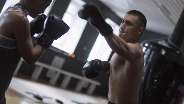 Boxing Partners Fighting in Gym alt
