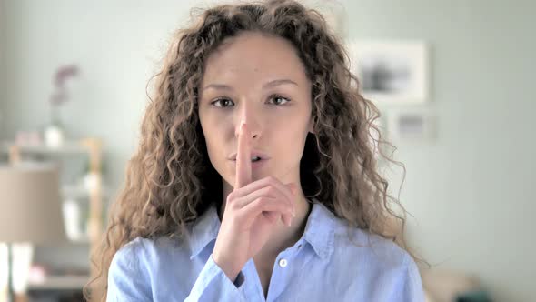 Silent, Silence Gesture by Curly Hair Woman