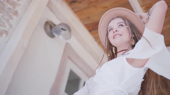 Bottom view of a young cowgirl in a hat