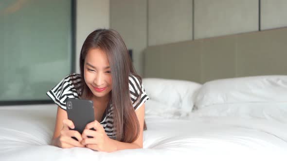 Young asian woman use smart phone