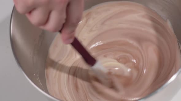 Pastry Chef Kneads the Chocolate Mousse for the Cake