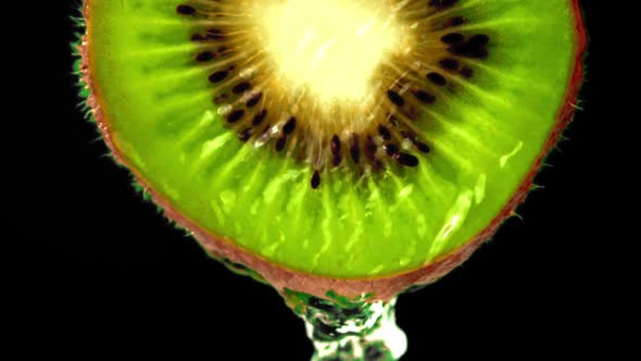 Super Slow Motion on the Kiwi Slice Drains Water