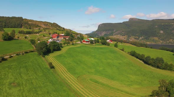 Beautiful aerial shot of a rural and remote farm in the mountains of Norway