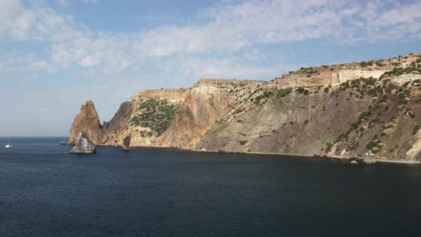 Aerial View From Above on Calm Azure Sea and Volcanic Rocky Shores