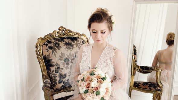 Bride In Wedding Dress With Flowers