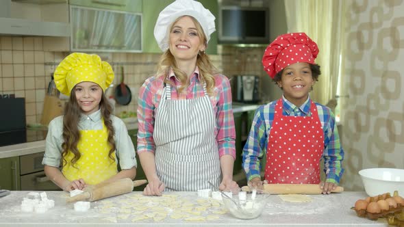 Happy Woman and Children, Kitchen.