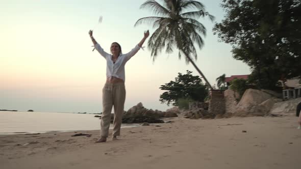 A Young Beautiful Girl on the Beach is Engaged in Poing