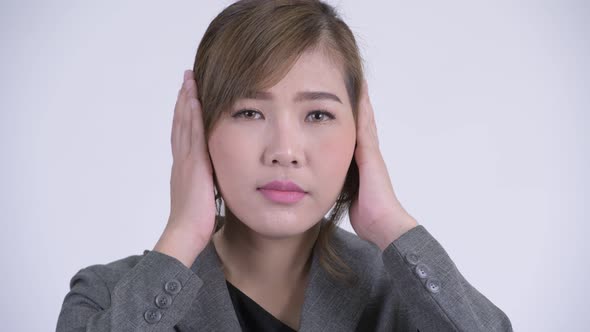 Face of Young Beautiful Asian Businesswoman Showing Three Wise Monkeys Concept