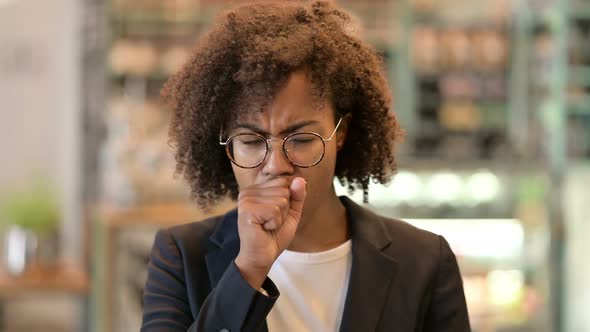 Sick Young African Businesswoman Coughing